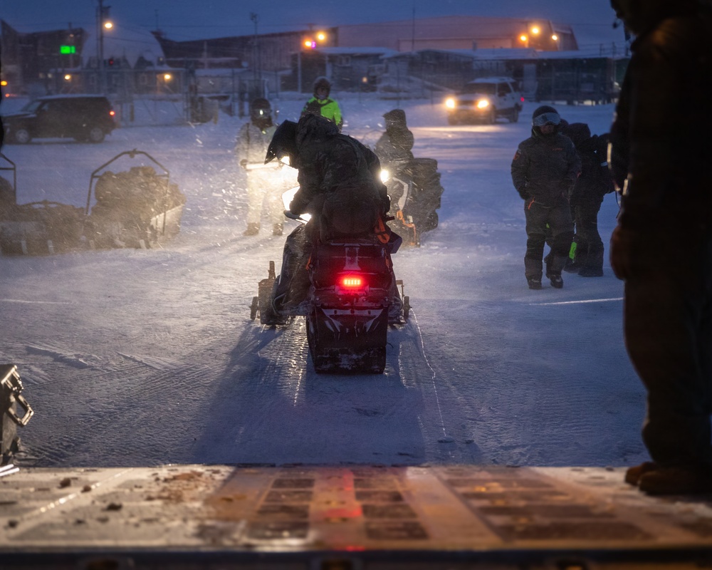 U.S. Marines offload gear from KC-130 after completing Toys for Tots mission.