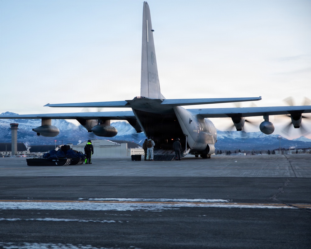 U.S. Marines offload gear from KC-130 after completing Toys for Tots mission.