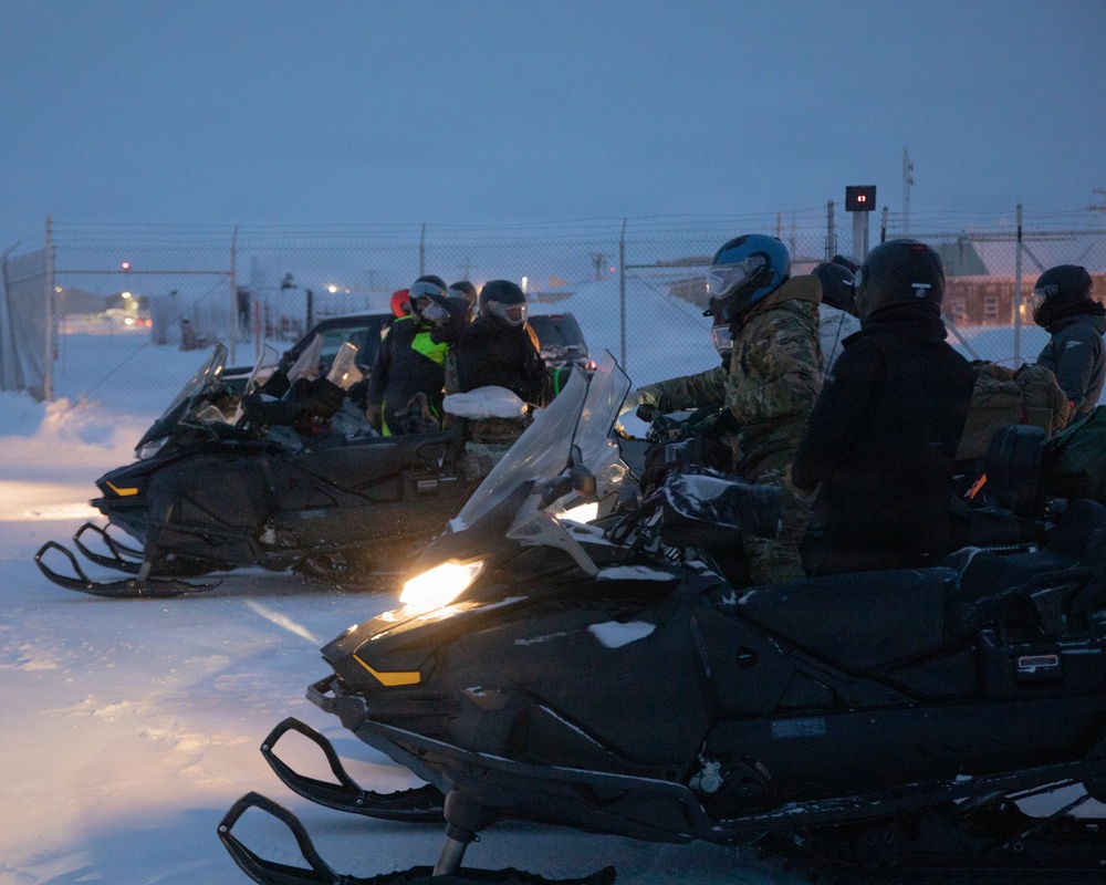 U.S. Marines offload gear from KC-130 after completing Toys for Tots mission.