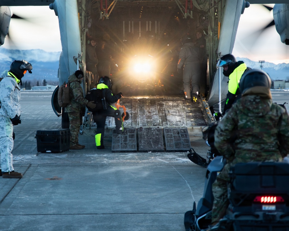 U.S. Marines offload gear from KC-130 after completing Toys for Tots mission.
