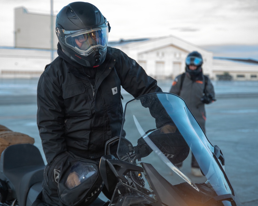 U.S. Marines offload gear from KC-130 after completing Toys for Tots mission.