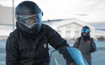 U.S. Marines offload gear from KC-130 after completing Toys for Tots mission.
