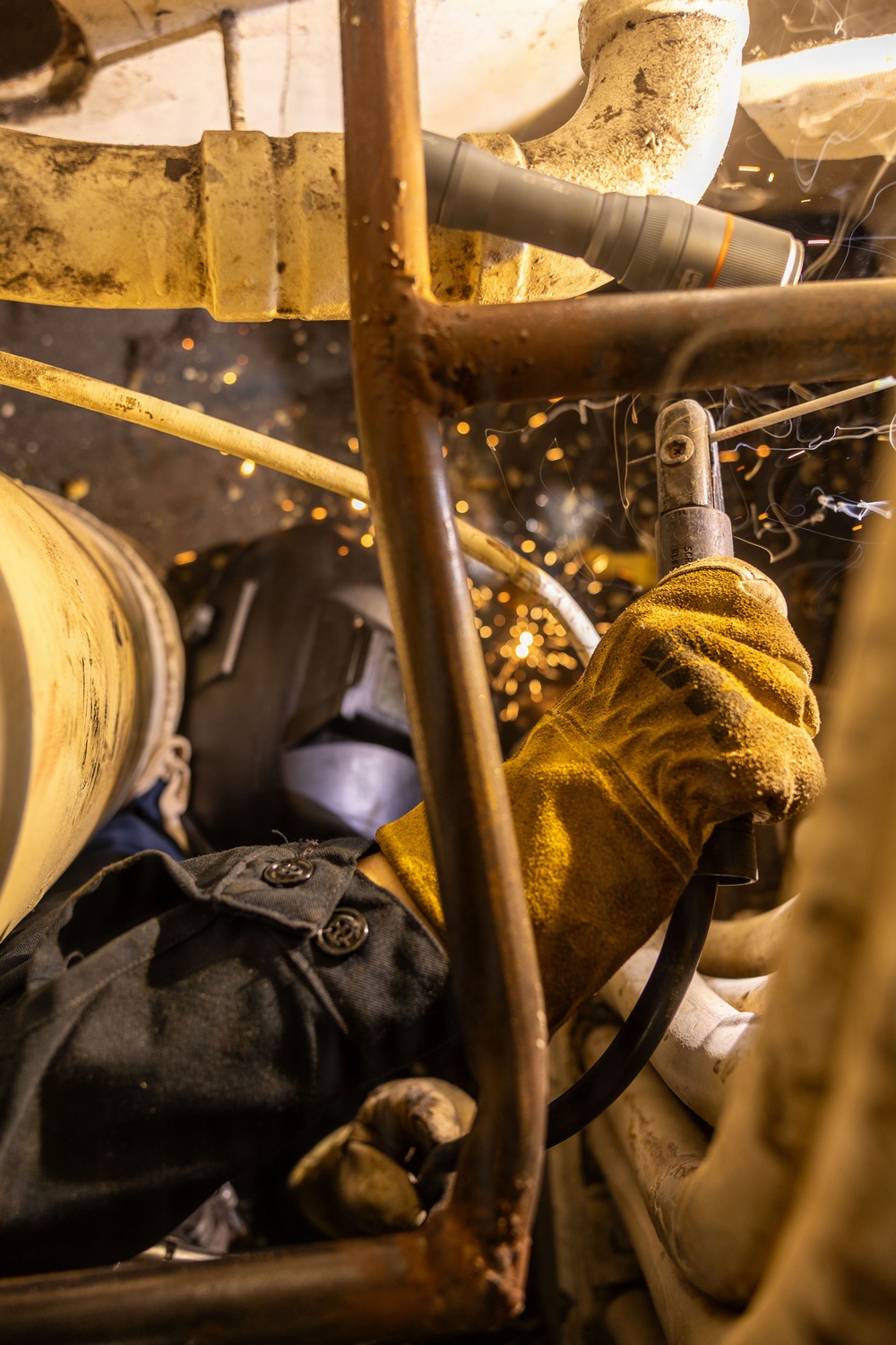 U.S. Sailor welds aboard USS San Antonio (LPD 17)