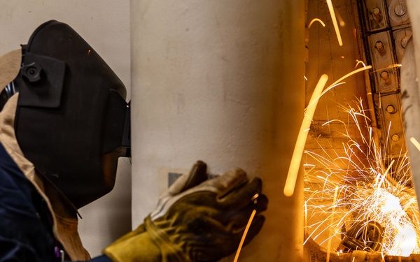 U.S. Sailor welds aboard USS San Antonio (LPD 17)