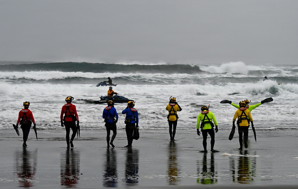 U.S. Coast Guard aviation survival technicians train as part of Advanced Helicopter Rescue School in Fort Stevens State Park, Oregon