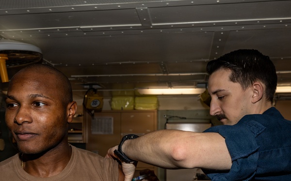 USS San Antonio (LPD 17) administer vaccinations