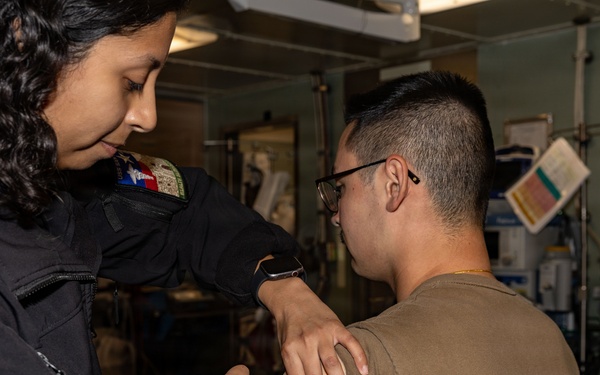 USS San Antonio (LPD 17) administer vaccinations