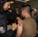 USS San Antonio (LPD 17) administer vaccinations
