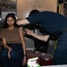 USS San Antonio (LPD 17) administer vaccines