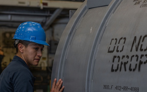 Iwo Jima Sailors Stow Aircraft Parts