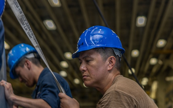 Iwo Jima Sailors Stow Aircraft Parts