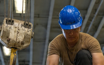 Iwo Jima Sailors Stow Aircraft Parts