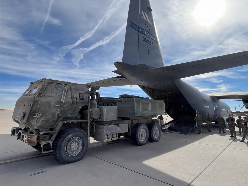 Soldiers and TXANG Airmen train together to load HIMARS onto C-130J