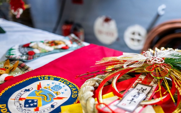 USS Howard (DDG 83) exchanges holiday gifts with sister ship JS Ikazuchi (DD 107)