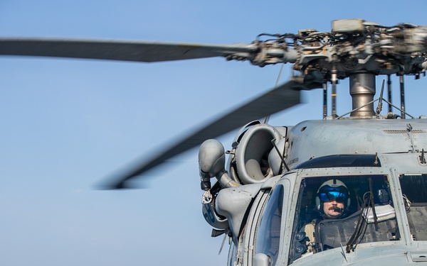 USS Mitscher (DDG 57) Sailors conduct flight operations with HSM 26 Sea Hawk