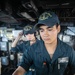 USS Mitscher (DDG 57) Sailor mans helm in ship bridge