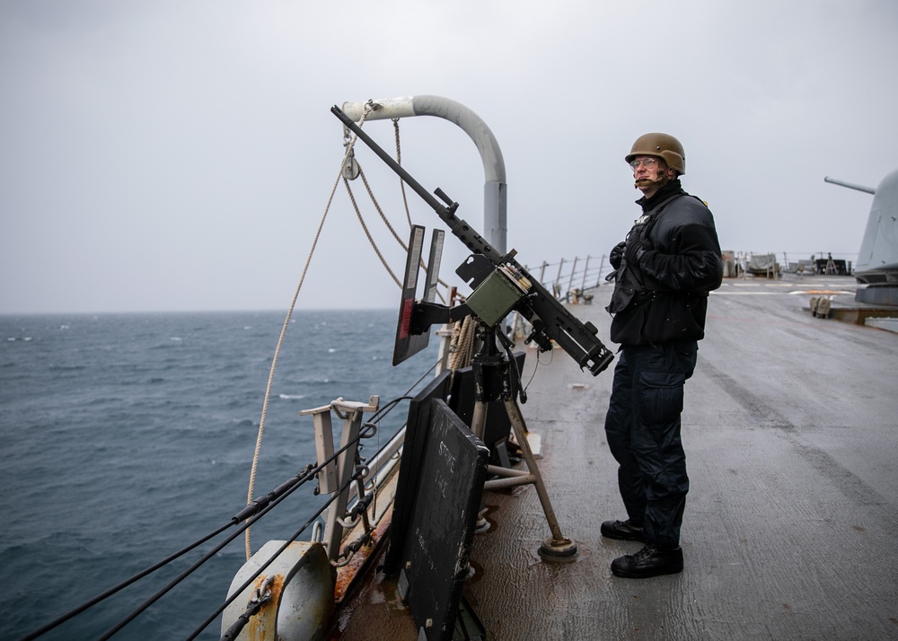 USS Mitscher (DDG 57) Sailor stands SCAT watch on ship foc'sle