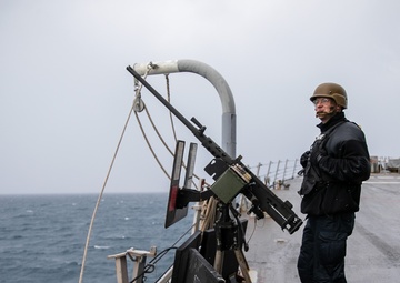 USS Mitscher (DDG 57) Sailor stands SCAT watch on ship foc'sle