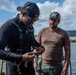 U.S. Navy and Panamanian services dive together during a Salvage Exercise