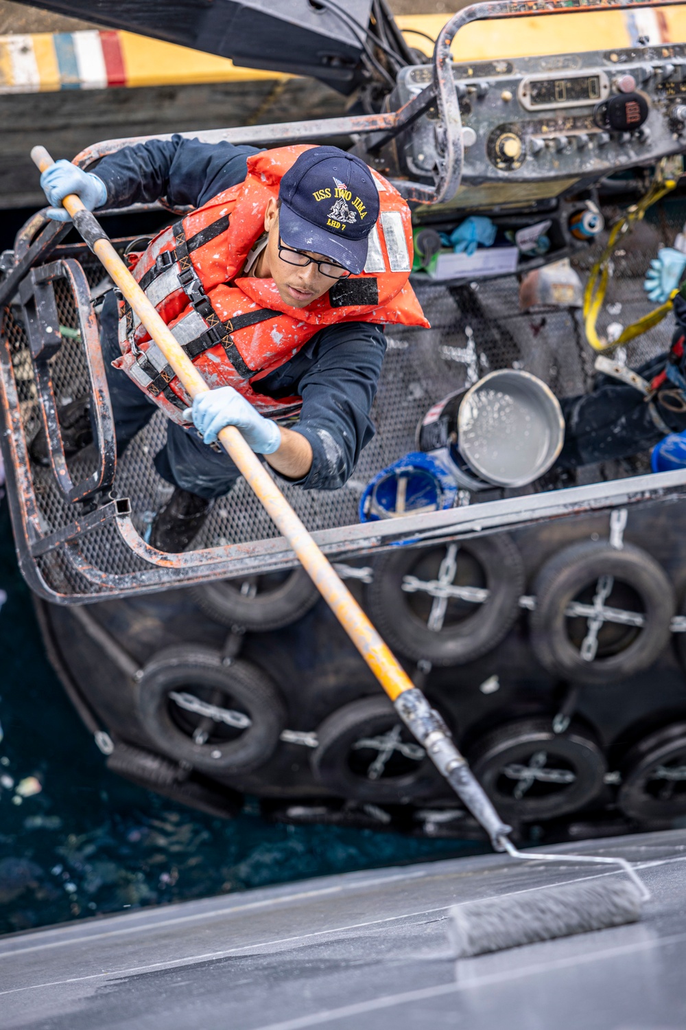 USS Iwo Jima Sailors Painting The Hull