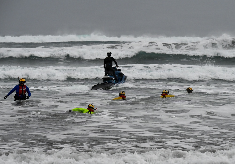U.S. Coast Guard aviation survival technicians train as part of Advanced Helicopter Rescue School in Fort Stevens State Park, Oregon