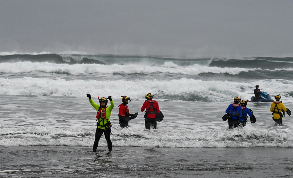 U.S. Coast Guard aviation survival technicians train as part of Advanced Helicopter Rescue School in Fort Stevens State Park, Oregon