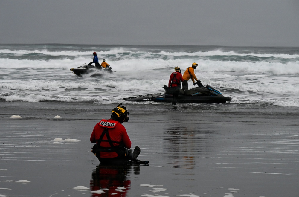 U.S. Coast Guard aviation survival technicians train as part of Advanced Helicopter Rescue School in Fort Stevens State Park, Oregon