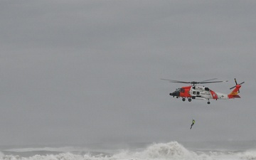 U.S. Coast Guard aviation survival technicians train as part of Advanced Helicopter Rescue School in Fort Stevens State Park, Oregon