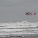 U.S. Coast Guard aviation survival technicians train as part of Advanced Helicopter Rescue School in Fort Stevens State Park, Oregon