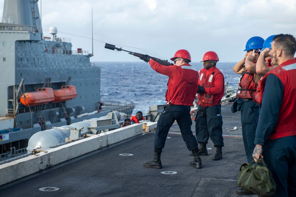 Abraham Lincoln conducts a fueling-at-sea with Henry J. Kaiser