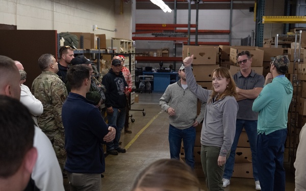 Racers and family assemble holiday baskets