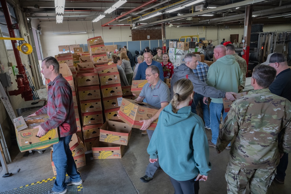 Racers and family assemble holiday baskets
