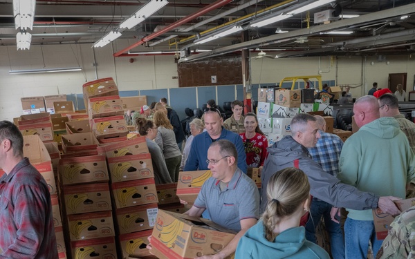 Racers and family assemble holiday baskets