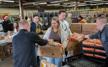 Racers and family assemble holiday baskets