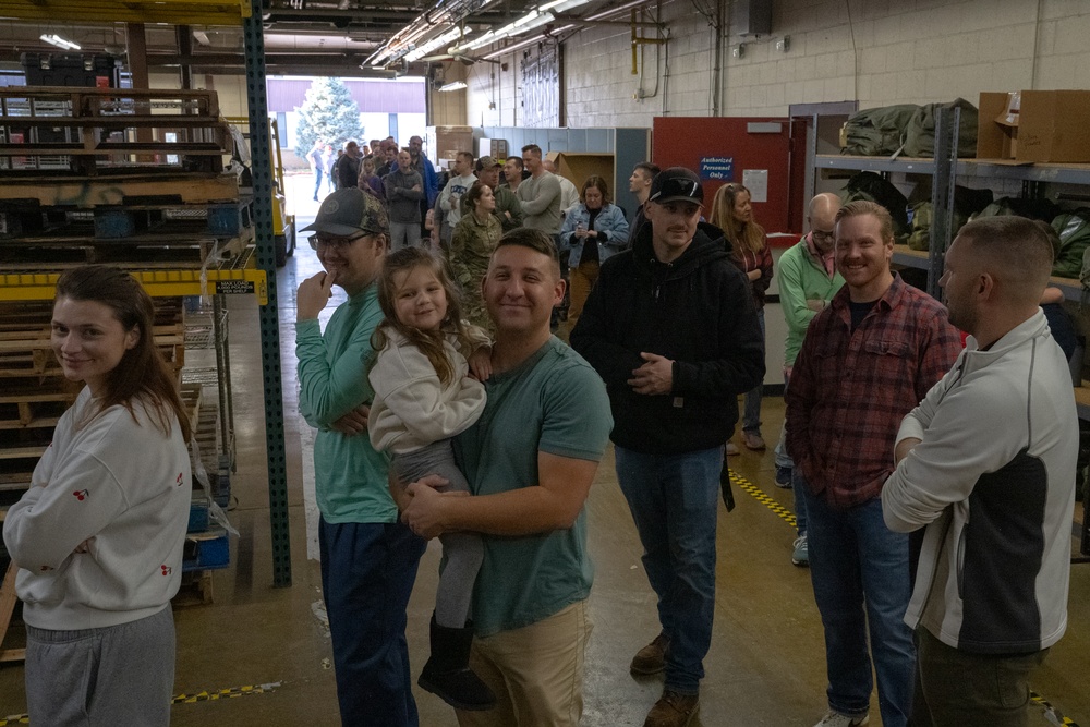 Racers and family assemble holiday baskets