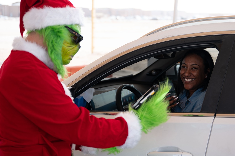 The Grinch spreads Christmas cheer for 379th ESFS defenders