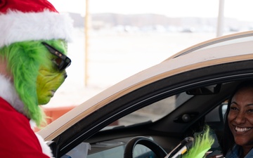 The Grinch spreads Christmas cheer for 379th ESFS defenders