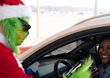 The Grinch spreads Christmas cheer for 379th ESFS defenders