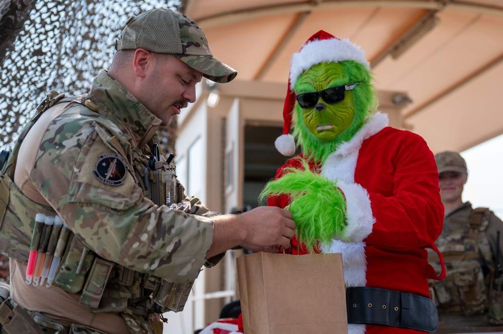 Grinch spreads holiday cheer to 379th ESFS defenders