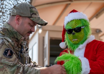 Grinch spreads holiday cheer to 379th ESFS defenders
