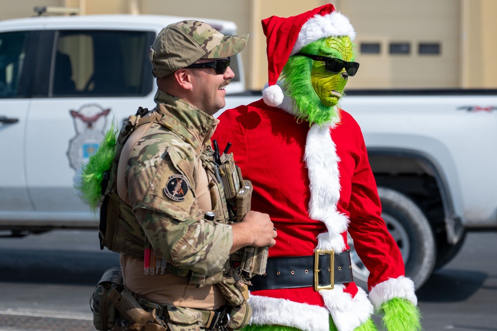 Grinch spreads holiday cheer to 379th ESFS defenders