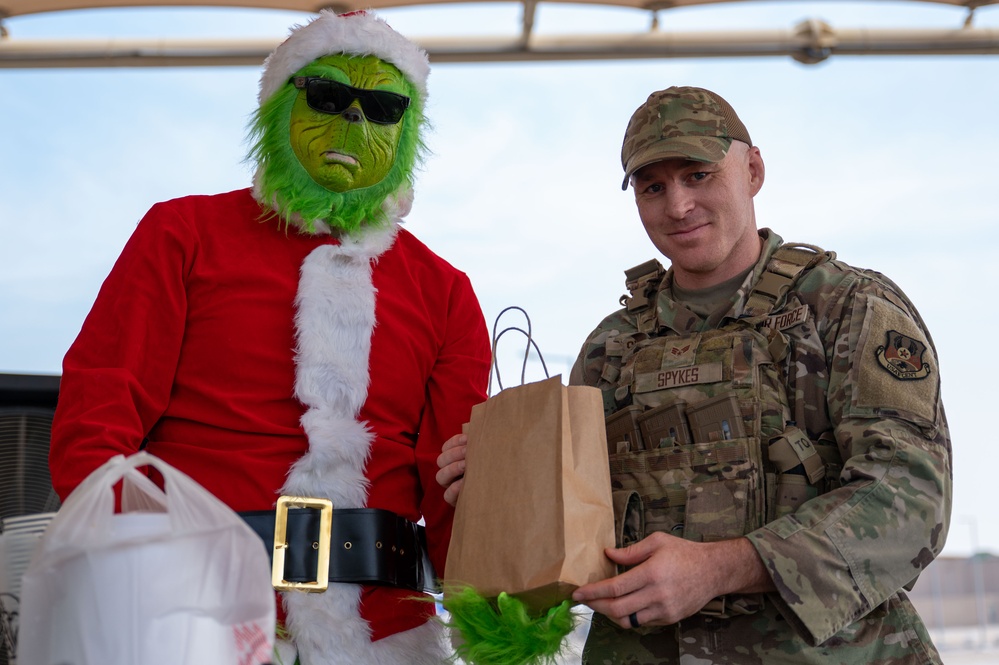 Grinch spreads holiday cheer to 379th ESFS defenders