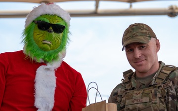 Grinch spreads holiday cheer to 379th ESFS defenders