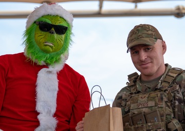 Grinch spreads holiday cheer to 379th ESFS defenders