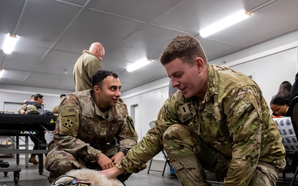 USO canine volunteers bring holiday morale boost to soldiers in Latvia