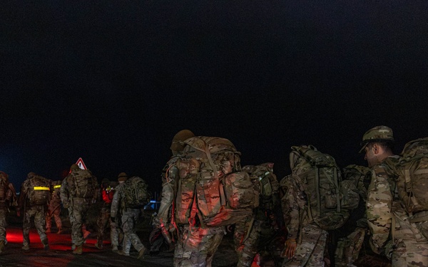 Best By Test participants navigate the night on a ruck