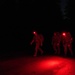 Best By Test participants navigate the night on a ruck