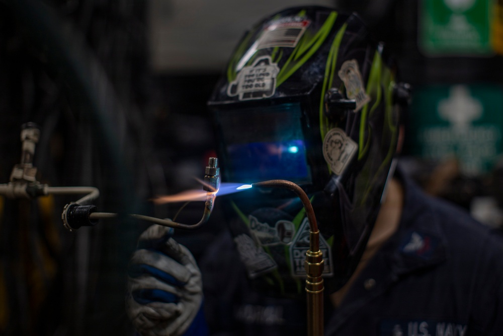 USS Winston S. Churchill (DDG 81) Sailor Conducts Routine Maintenance