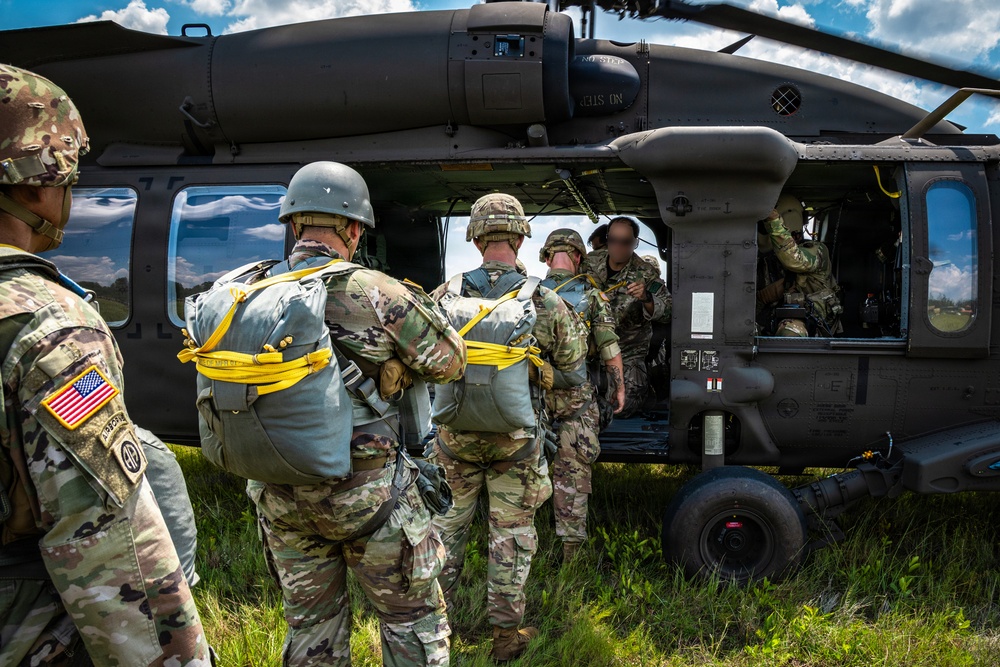 Soldier loading into a UH-60 ready to conduct Airborne operation