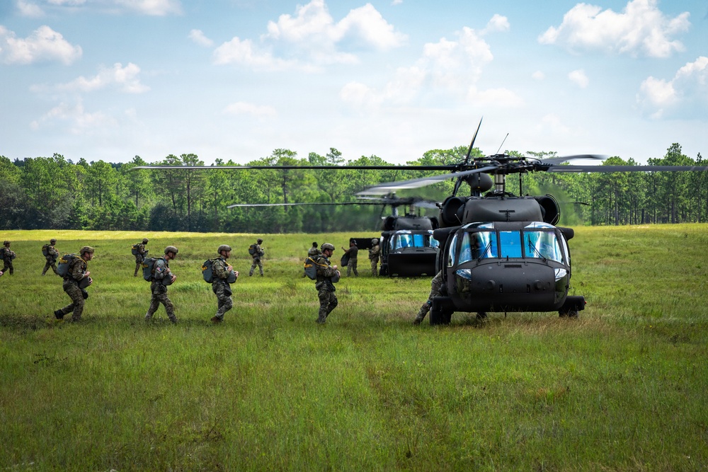 Soldier loading into a UH-60 ready to conduct Airborne operation